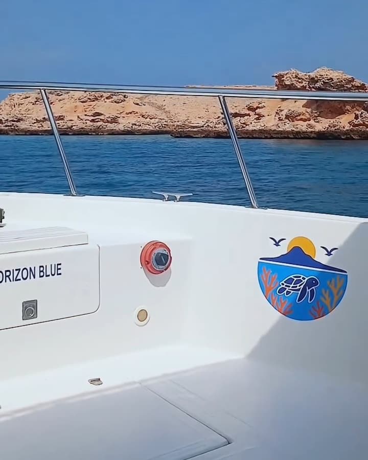 View from the deck of a Horizon Blue boat toward one of the Daymaniyat Islands